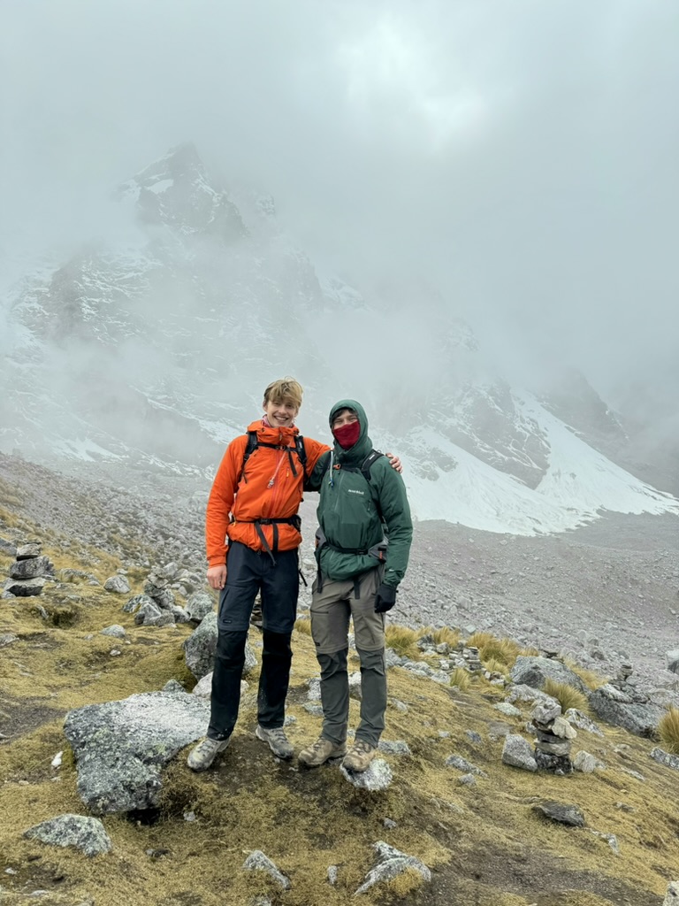 Tom hiking in the mountains with a friend
