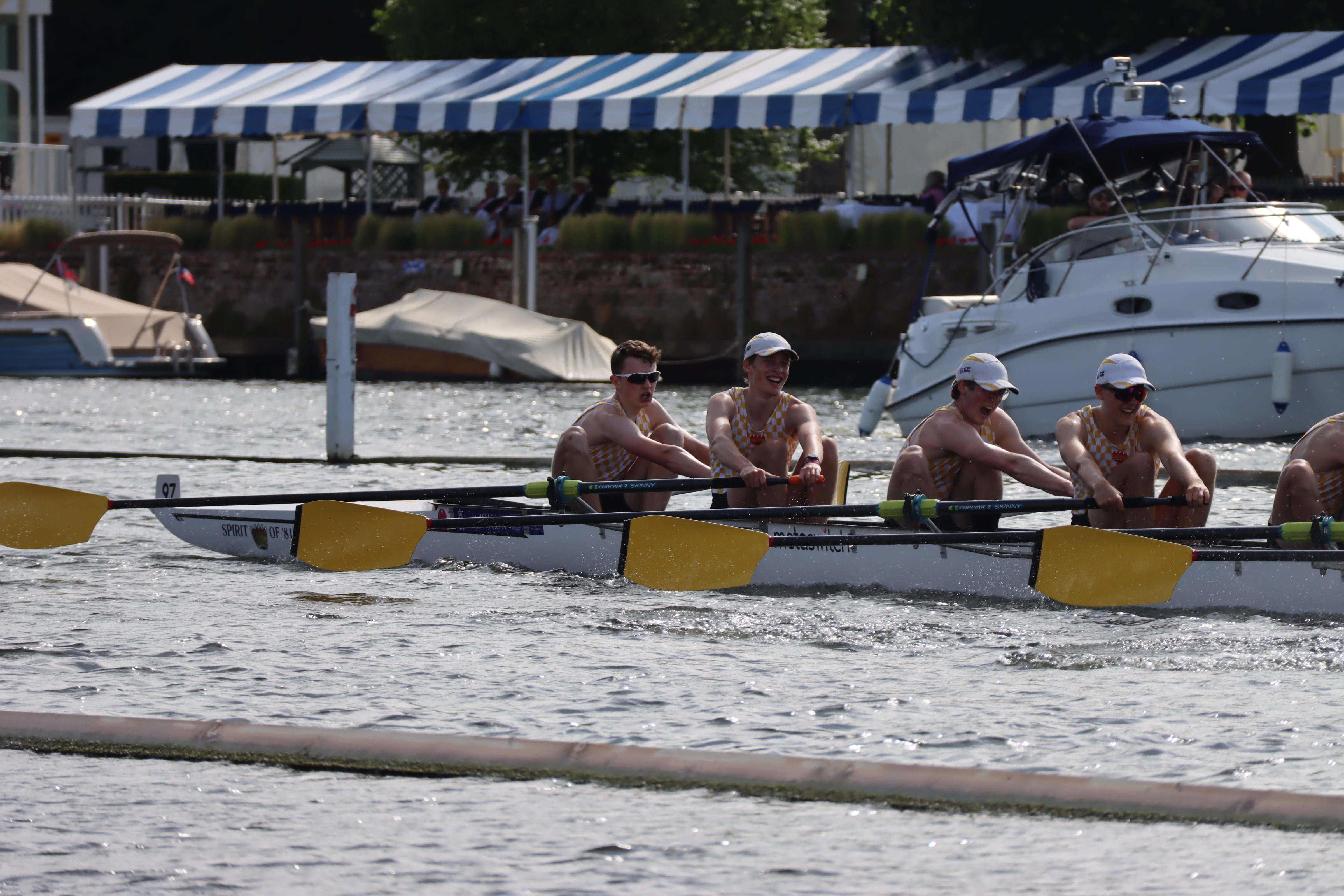 Tom rowing on the water with a crew